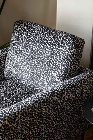 Close-up image of the The Edie Monochrome Leopard Velvet Armchair