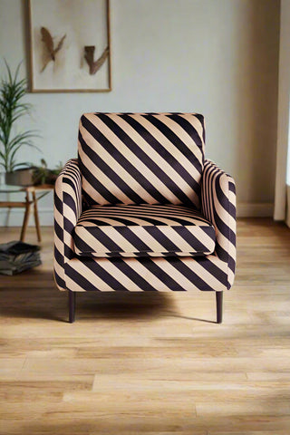 Front view of the Edie armchair in a neutral living room.