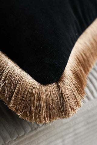 Close-up image of the To The Stars Velvet Fringe Feather Filled Cushion