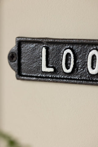 Close-up of the Toilet Door Hanging Sign.