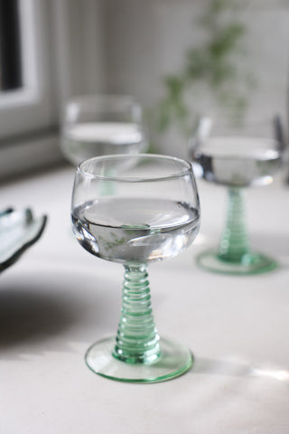 Lifestyle image of the 70s French Style Wine Glass In Green