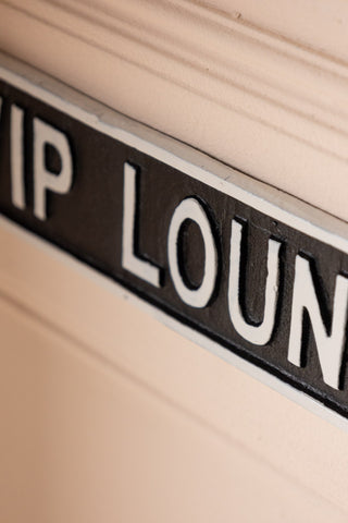 Close-up of the VIP Lounge Sign displayed on a wall.