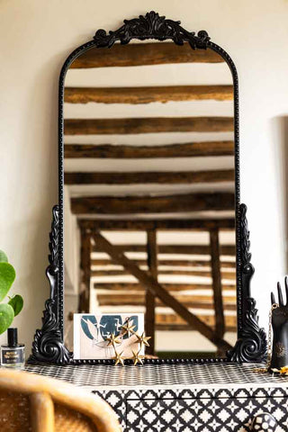Lifestyle image of the Vintage Inspired Black Framed Decorative Mirror