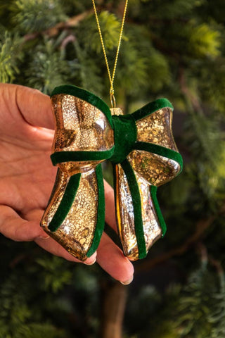 Lifestyle image of the Vintage-Style Green Bow Glass Christmas Tree Decoration