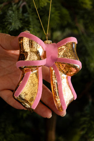Lifestyle image of the Vintage-Style Pink Bow Glass Christmas Tree Decoration