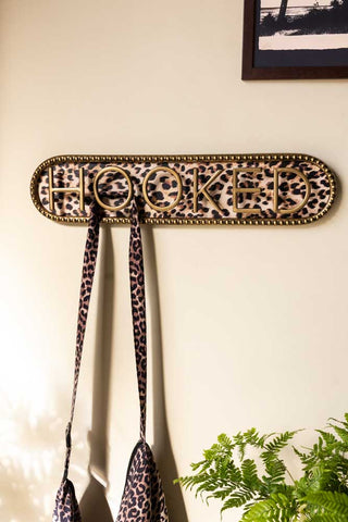 Lifestyle image of the Vintaged-Style Leopard Print Wall Hooks