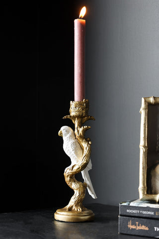 Lifestyle image of the White Parrot Candlestick Holder