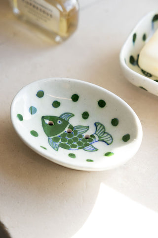 Lifestyle image of the White & Green Fish Soap Dish