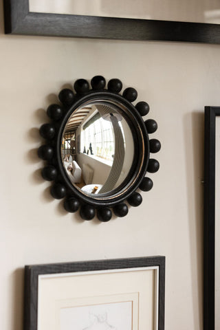 Lifestyle images of the Black Bobbin Convex decorative Mirror.