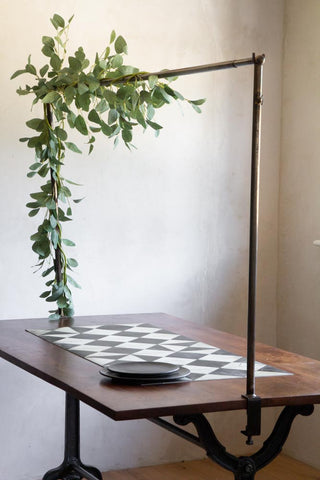 Close-up lifestyle image of the Clamp-On Table Stand For Hanging Decorations Over Your Table