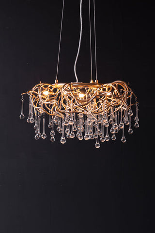 Image of the Rose Gold Droplet Chandelier lit up