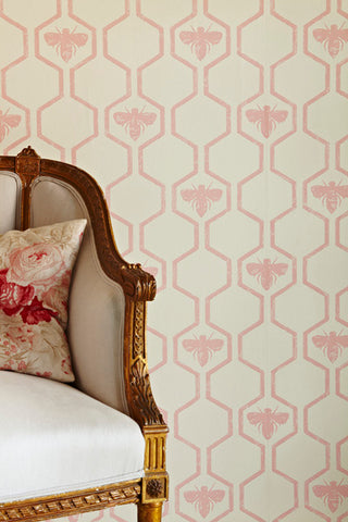 detail image of barneby gates honey bees wallpaper - rose on stone with cream and gold sofa and pink patterned cushion