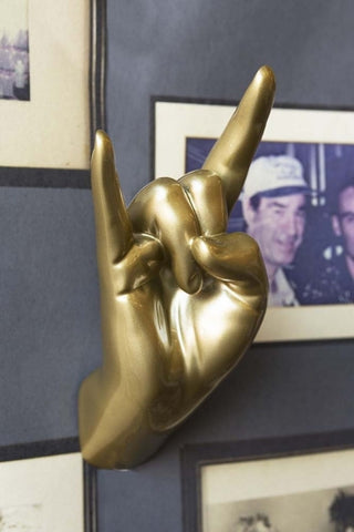 Lifestyle image of the Gold Rock On Hand Wall Art & Coat Hook on a white wall