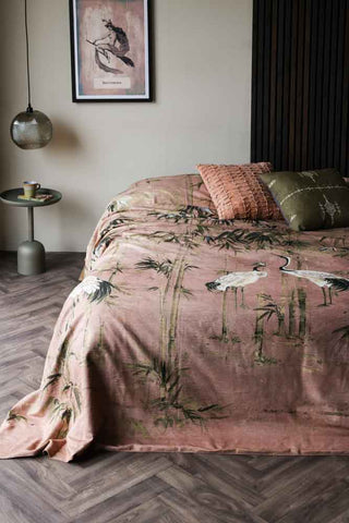 Lifestyle image of the Cedomin Quilt Tapestry Throw In Rose