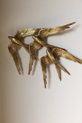 Lifestyle image of the Golden Swallows Bird Wall Hanging