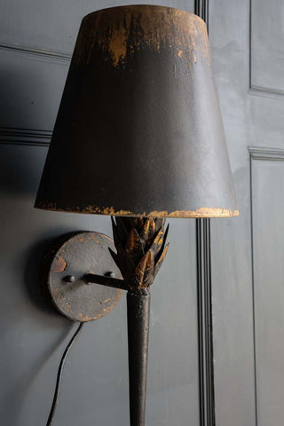 Close-up image of the Aged Effect Black & Old Gold Torch Wall Light