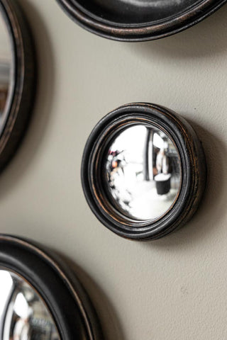 Lifestyle image of the Antique Black Thin Framed Extra Small Convex Mirror