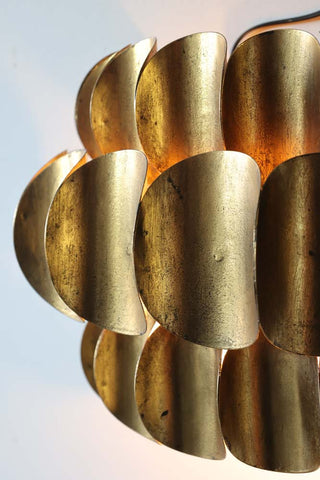 Image of the finish for the Antique Brass Curve Disc Wall Light