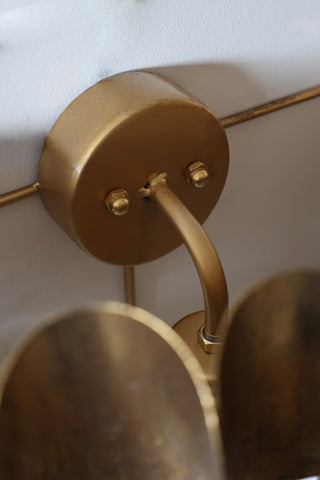 Image of the wall fitting for the Antique Brass Curve Disc Wall Light