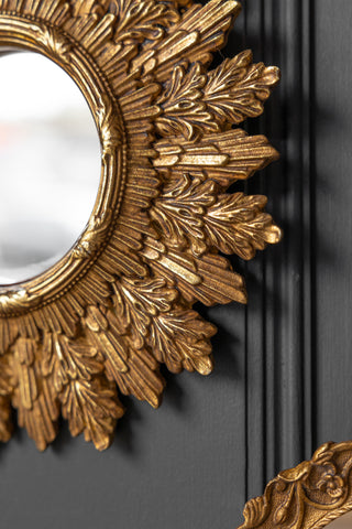 Close-up image of the Antique Gold Ornate Leaf Small round Mirror
