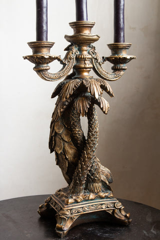 Image of the back of the Antique Gold Peacock Trio Candlestick Holder