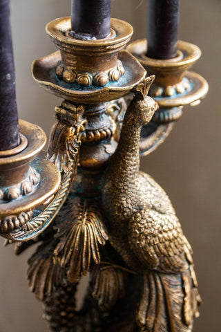 Close-up of the candle holders on the Antique Gold Peacock Trio Candlestick Holder