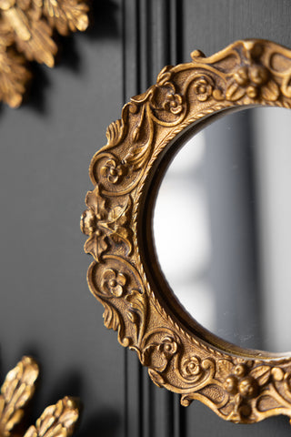 Close-up image of the Antique Gold Small Ornate round Mirror