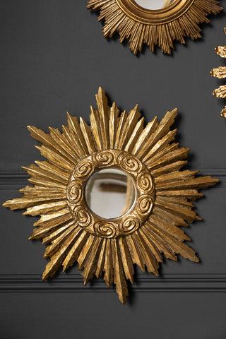 Lifestyle image of the Antique Gold Small Star Convex Mirror