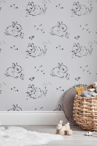 Lifestyle image of the Bear & Beau Little Bunny Wallpaper In Grey