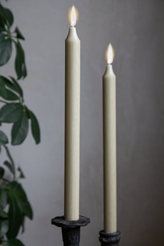 Image of 2 lit Sage Green Beautiful Dinner Candles