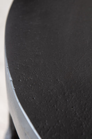 Close-up image of the table top on the Matt Black Drip Side Table
