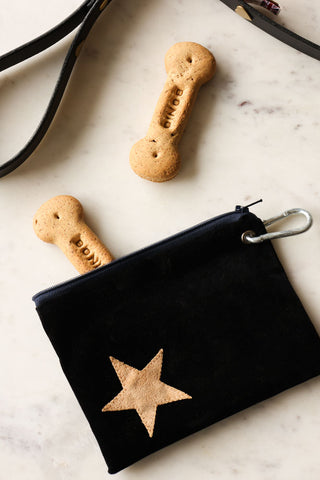 Lifestyle image of the Black With Faux Tan Suede Treat Pouch