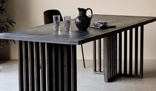 Landscape image of the Black Wood Dining Table With Slatted Legs
