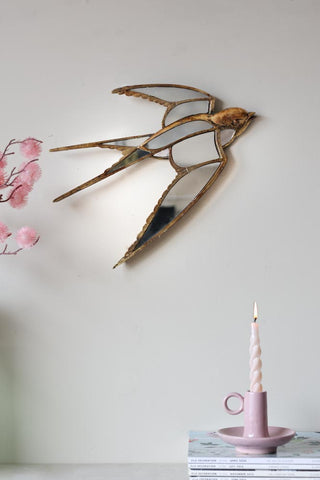 Lifestyle image of the Brass & Mirror Swallow Wall Decoration