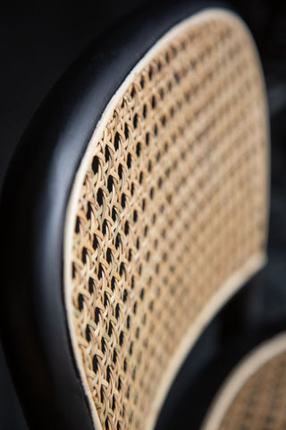 Image of the detail on the seat back of the Chez Pitou Black Wood & Woven Cane Bar Stool
