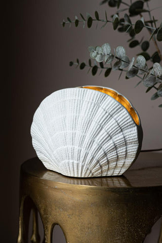 Lifestyle image of the Clam Gold Shell Table Lamp