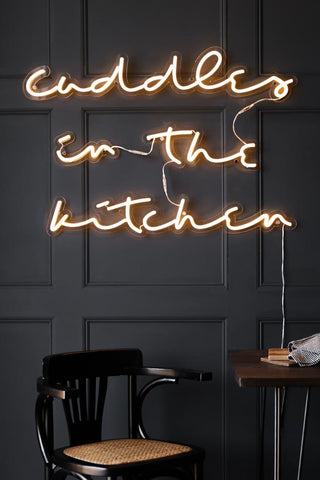 Lifestyle images of the Cuddles In The Kitchen Neon Wall Light