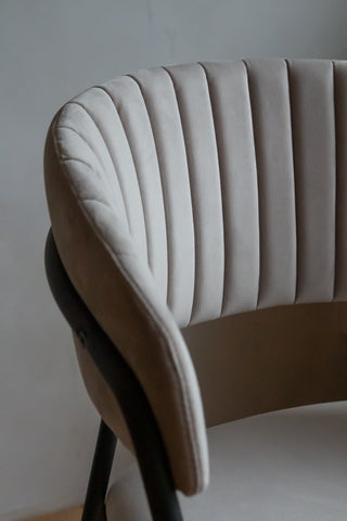 Close-up image of the back rest on the Curved Back Velvet Dining Chair In Mink Grey