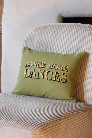 Lifestyle image of the Dance More Dances Embroidered Green Cushion