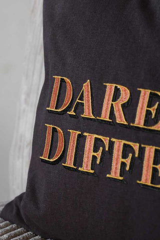 Detail image of the Dare To Be Different Embroidered Brown Cushion embroidery