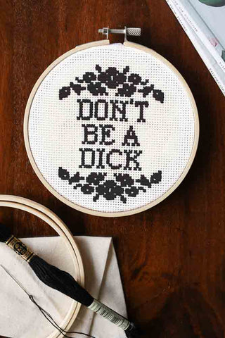 Lifestyle image of the Don't Be A Dick Cross Stitch Kit