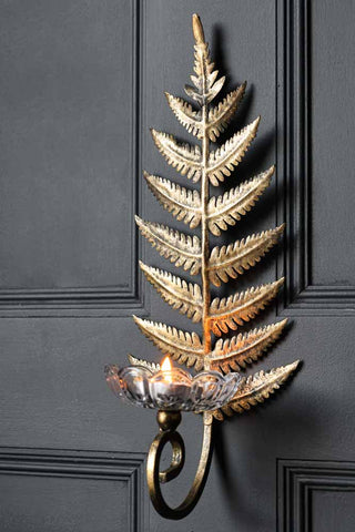 Lifestyle image of the Fern Leaf Wall Sconce With Glass
