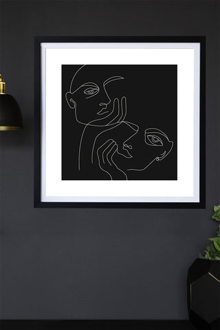 Lifestyle image of the Black Lovers Art Print hanging on a wall framed
