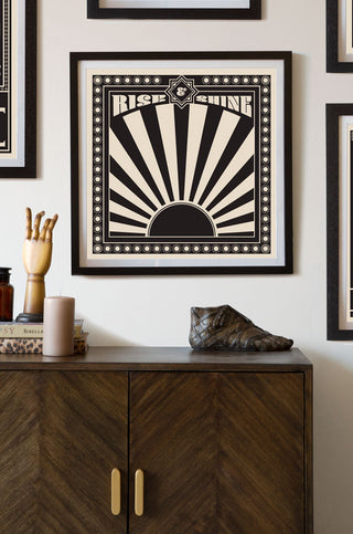 Lifestyle image of the Framed Sunrise Art Print hanging on the wall