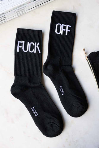 Lifestyle image of the Fuck Off Black Socks. 