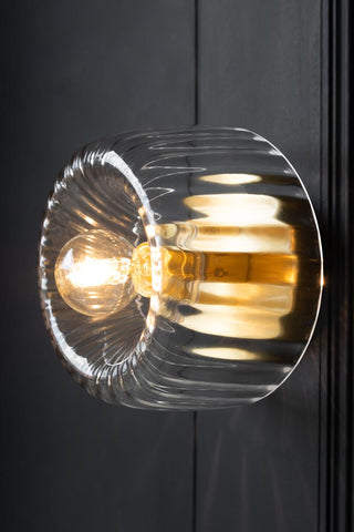 Close-up image of the Ribbed Glass & Brass Wall Light