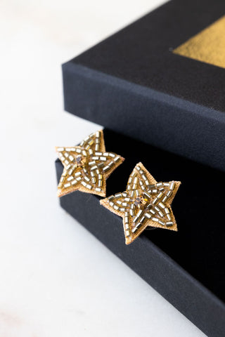 Lifestyle image of the Gold Beaded Star Stud Earrings