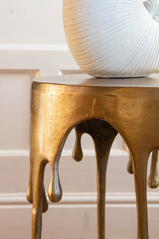 Close-up image of the edge on the Gold Drip Coffee Table