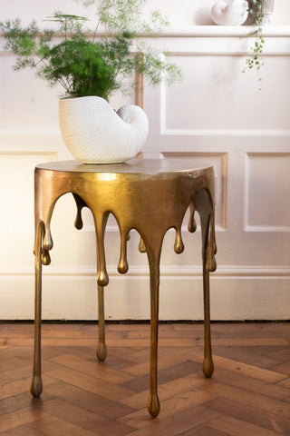 Lifestyle image of the Gold Drip Coffee Table