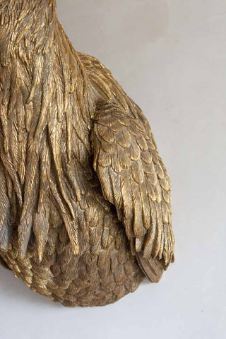Close-up image of the feather detail on the body of the Gold Heron Wall Light